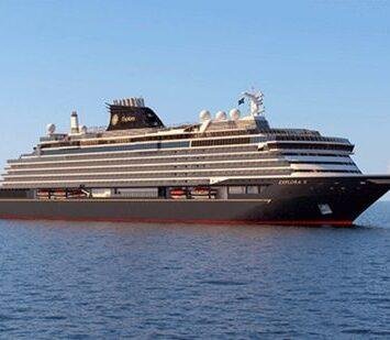 A Greek isle explora large, elegant cruise ship sails in calm, blue waters under a clear sky. The ship exudes luxury with its sleek design and multiple decks.