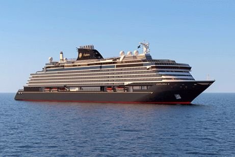A Greek isle explora large, elegant cruise ship sails in calm, blue waters under a clear sky. The ship exudes luxury with its sleek design and multiple decks.