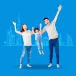 Happy family standing together outside a modern UAE buildings