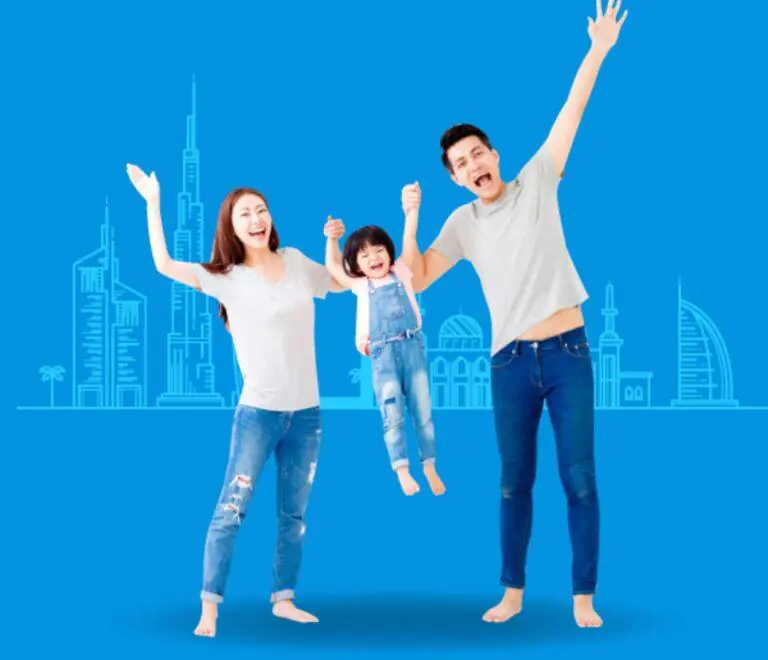 Happy family standing together outside a modern UAE buildings