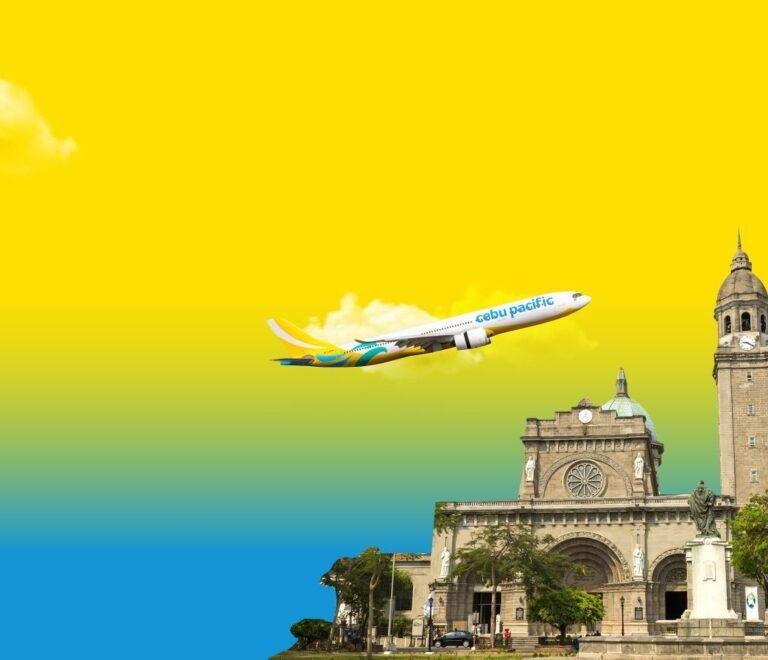 Cebu Pacific airplane flying above the Manila Cathedral in the Philippines