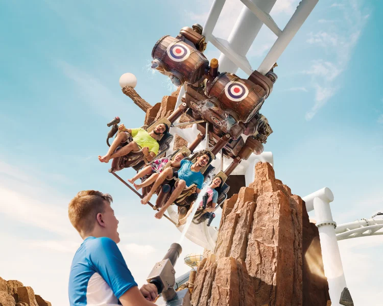 Visitors enjoying water slides and attractions at Yas Waterworld Abu Dhabi
