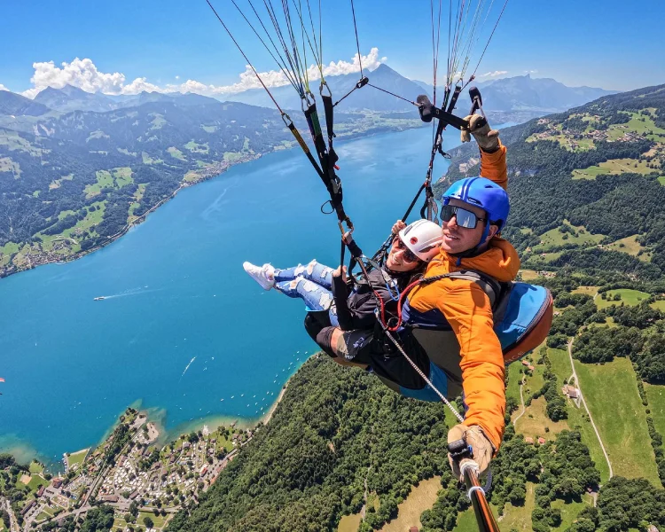 Paragliding tandem jump with breathtaking views of Swiss mountains and valleys