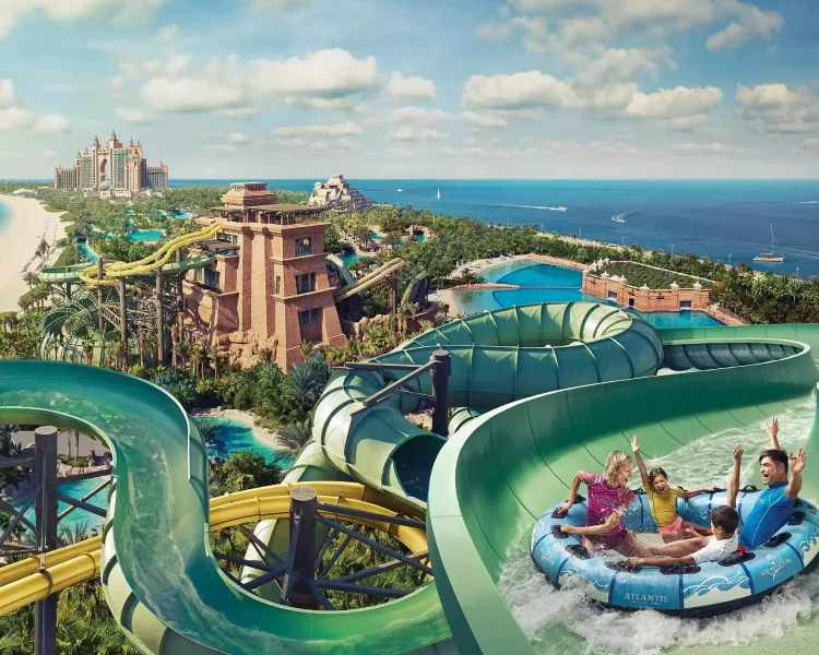 Family having fun on water slides at Atlantis Aquaventure Waterpark