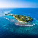 Tropical island in the Maldives surrounded by turquoise waters